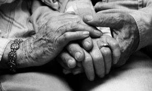 old couple holding hands