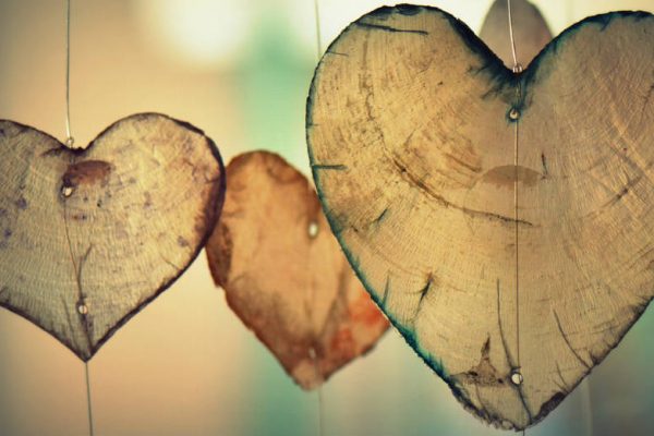 Hearts hanging by thread