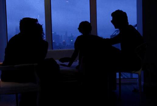 Swinging couples at a late night party