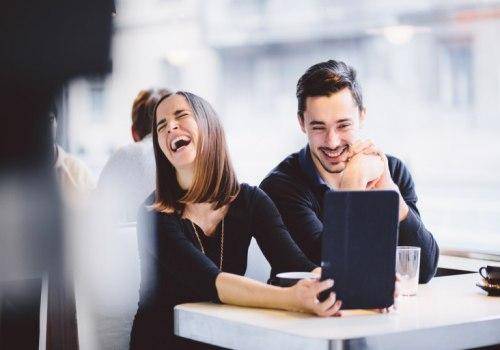 man and woman laughing together