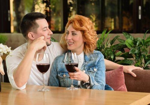 man and woman having wine