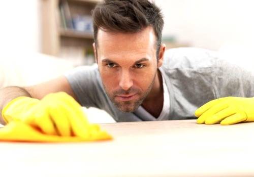 man cleaning the house