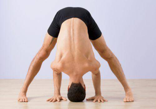 Wide legged forward fold yoga pose
