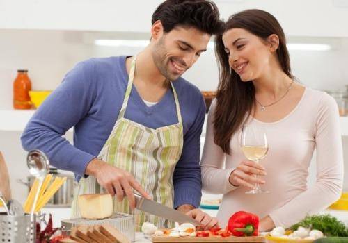 man cooking for woman