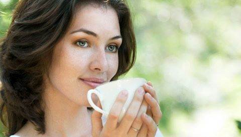 Beautiful woman having tea