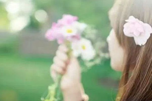 Girl with Flowers in Hand