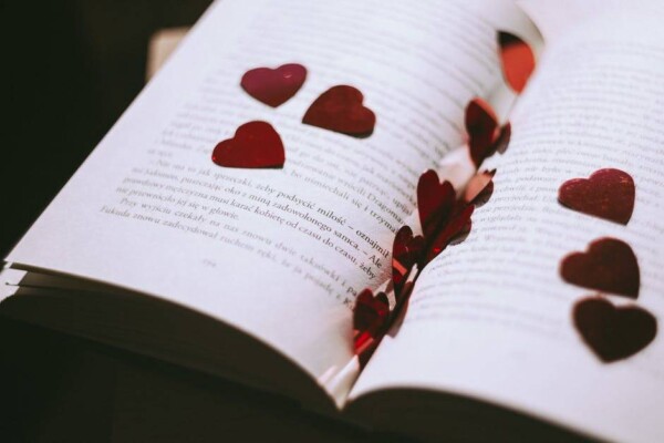 Heart cutouts on pages of a book