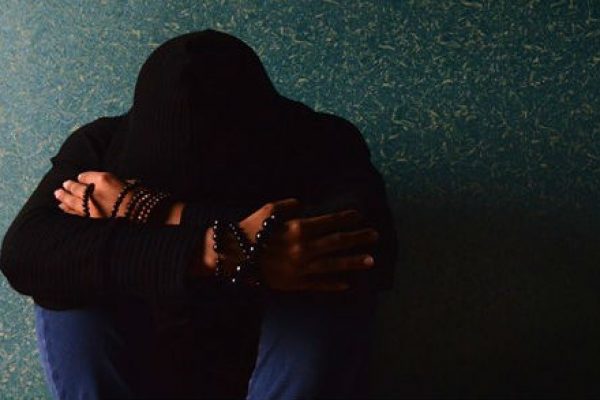 Man Hiding Face