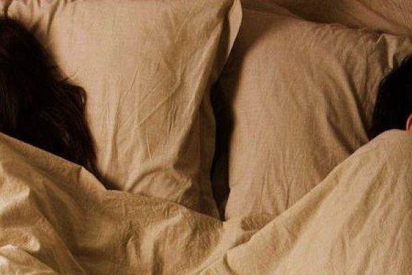 Man Sleeping but Woman Not