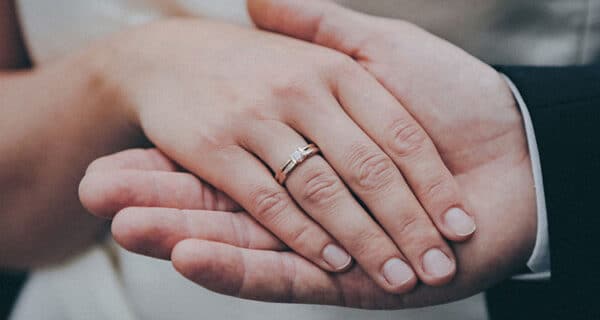 beautiful shot hands newly married couple