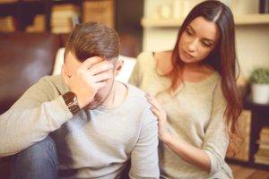 girl supporting man