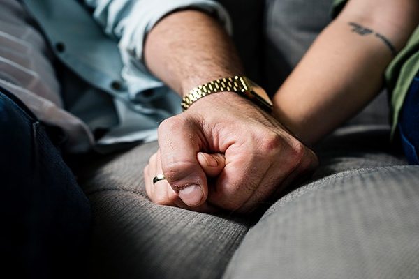 Hands on Sofa