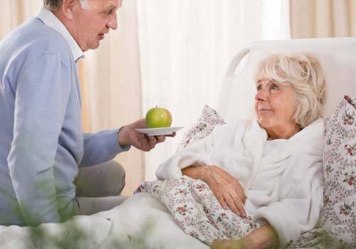 husband taking care of sick wife