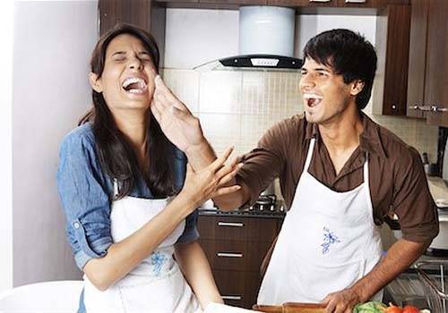 indian couple cooking