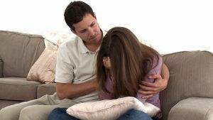 man comforting wife