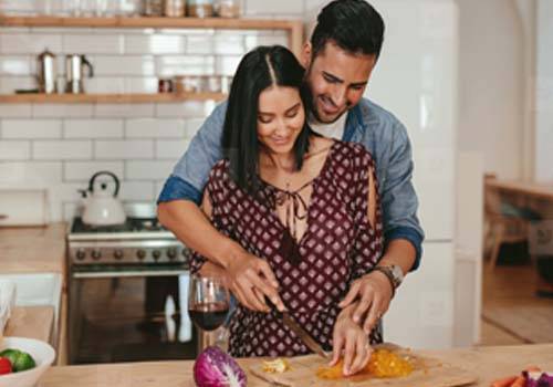 man women cooking
