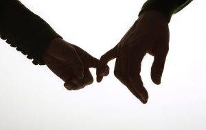 woman holding hand
