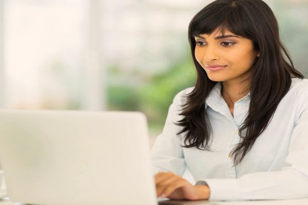 Happy woman in office