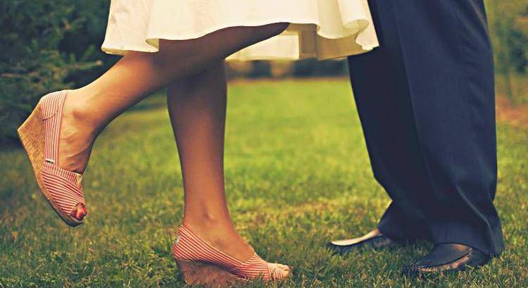 feet of a man and woman dancing