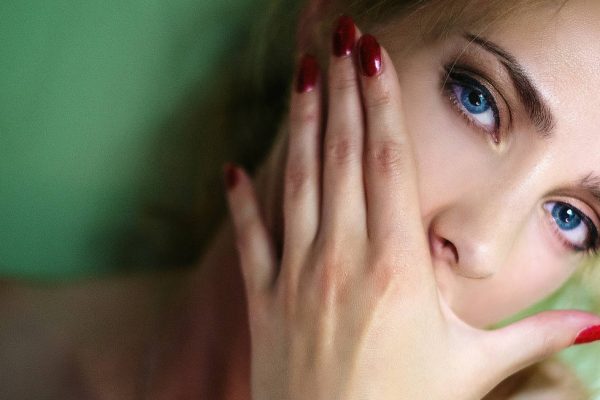 Girl covering her mouth