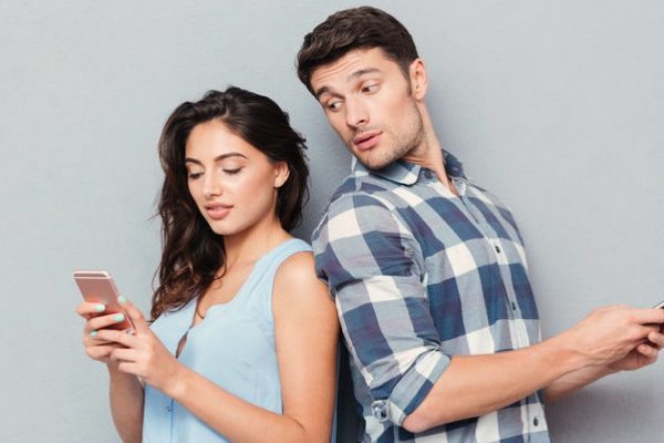 man looking into wife's phone