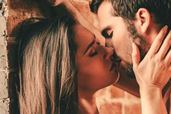 side view of couple kissing