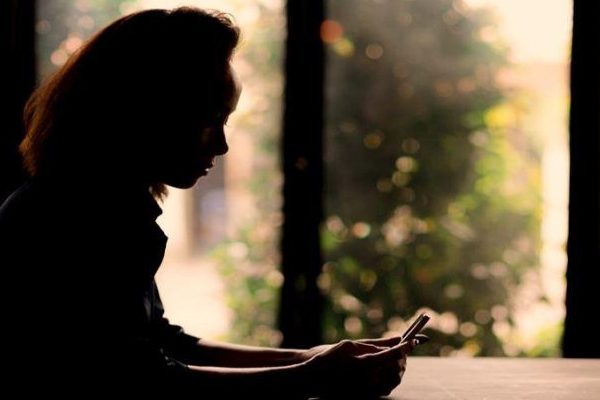 woman checking phone