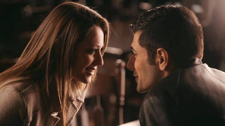 Couple at the bar staring at each other's eyes