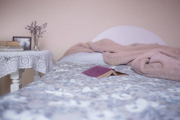 bed with book & blanket
