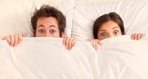 couple under sheets