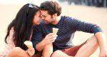happy flirty couple eating icecream