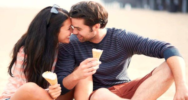 happy flirty couple eating icecream