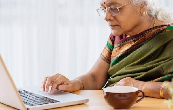 elderly-Indian-woman-with-a-laptop