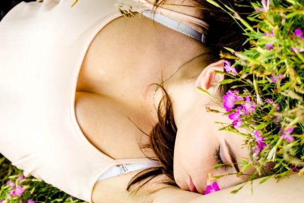 woman lying on grass