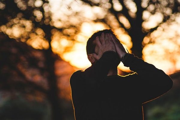 Man crying into his hands