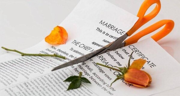 Marriage certificate being cut into two