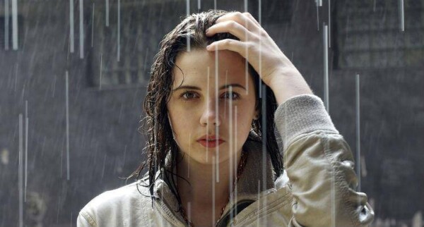 Beautiful woman in rain