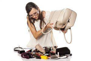 woman emptying purse