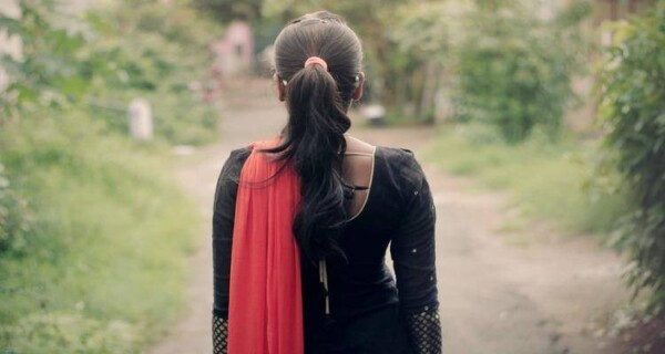 The back of a girl in Indian wear