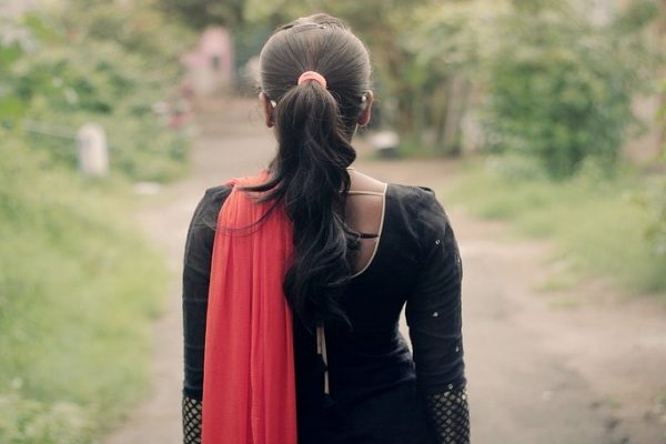 The back of a girl in Indian wear
