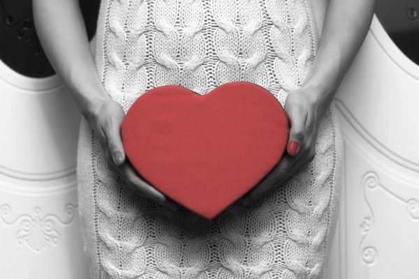 Woman Holding Heart