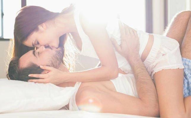couple kissing before sex