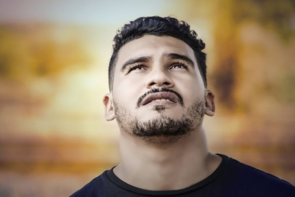 upset man looking up at the sky