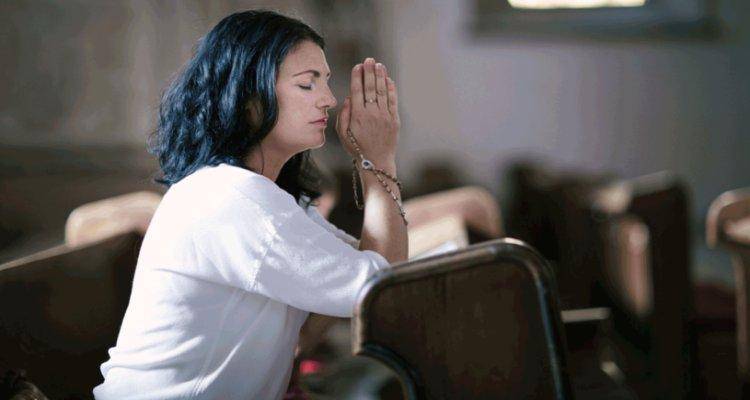 A woman praying in church