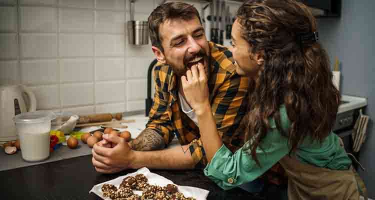 Wife feeding her husband with love