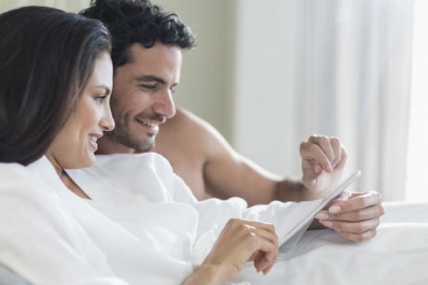 Couple together in bed