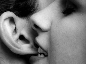 girl nibbling ear