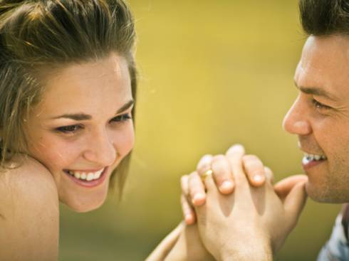 man holding hands of a woman