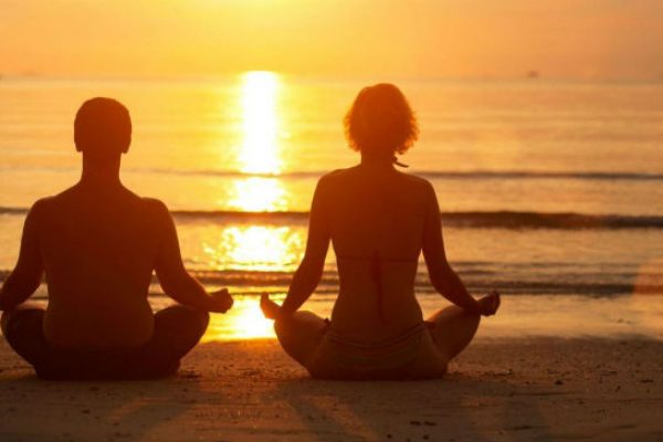 Man and woman meditating