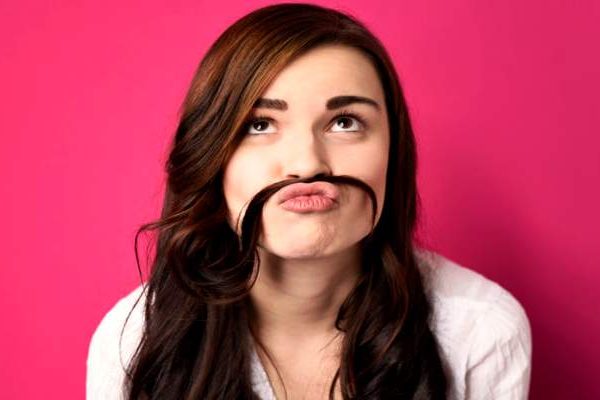 A-pretty-girl-using-her-long-hair-as-a-moustache